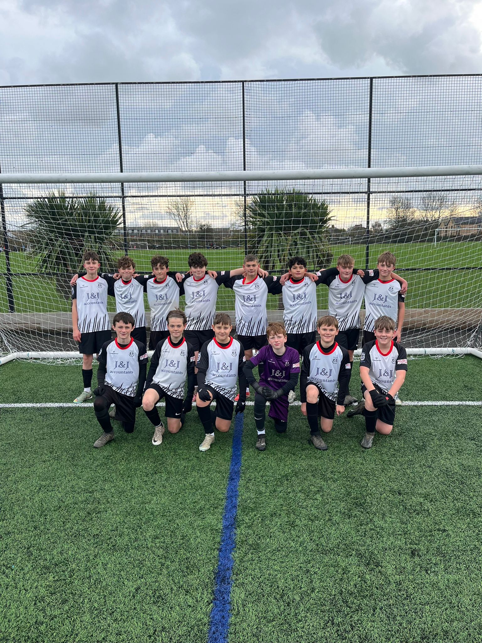 Youth football team in J&J sponsored kit